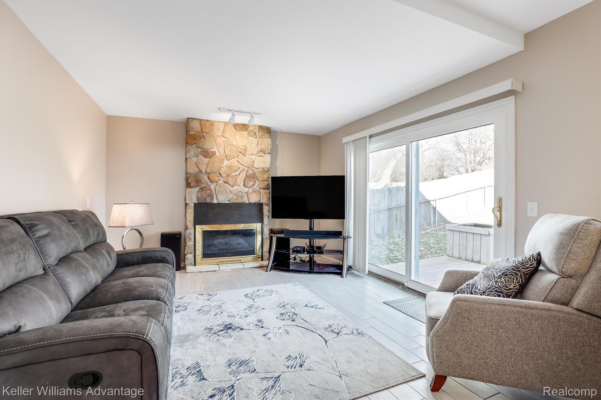 42448 Park Ridge Road Novi, MI 48375 - Photo 9 of 26 Family room with fireplace