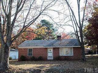 914 Frank Street Roxboro, NC 27573 - Photo 1 of 1 front view of a house with a trees