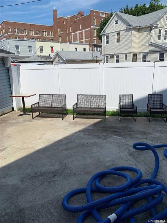 127-22 Hawtree Creek Road Queens, NY 11420 - Photo 12 of 12 a view of a kitchen with a sink and cabinets
