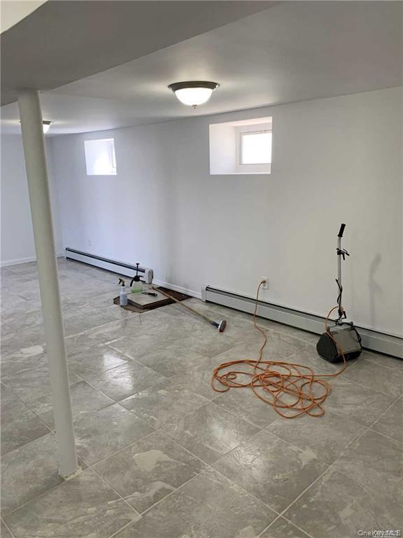 127-22 Hawtree Creek Road Queens, NY 11420 - Photo 7 of 12 a view of a room with gym equipment