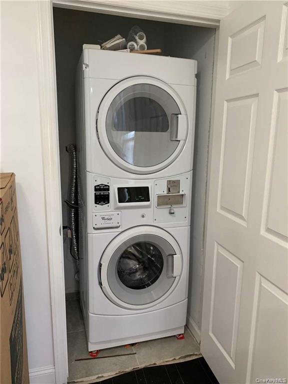 127-22 Hawtree Creek Road Queens, NY 11420 - Photo 10 of 12 a utility room with dryer and washer