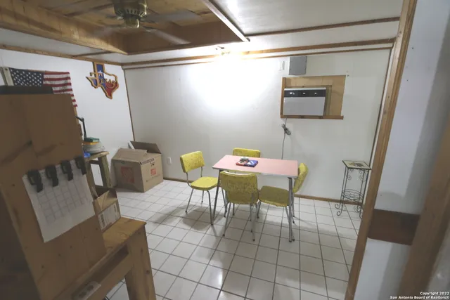 a view of a patio with table and chairs