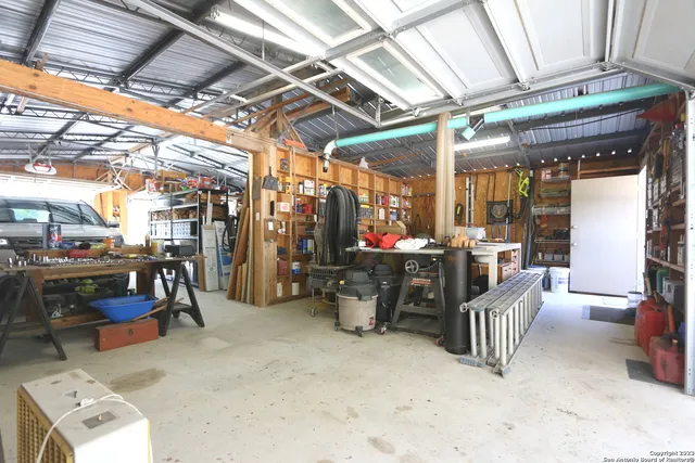 a view of a chair and tables in the patio