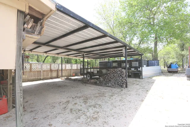 a backyard of a house with barbeque oven