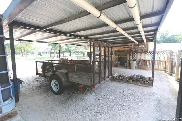 a view of a backyard with sitting area