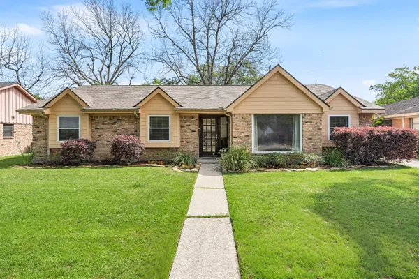 a front view of a house with yard
