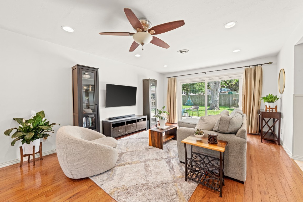 5827 Rutherglenn Drive Houston, TX 77096 - Photo 9 of 30 a living room with furniture ceiling fan and a large window
