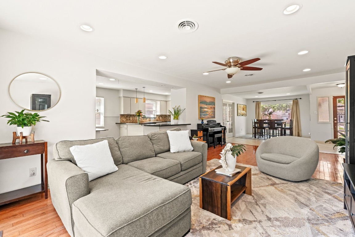 5827 Rutherglenn Drive Houston, TX 77096 - Photo 11 of 30 a living room with furniture kitchen view and a potted plant