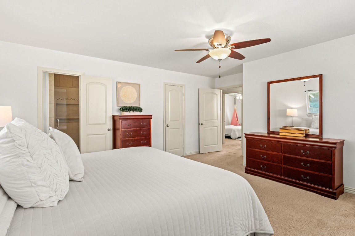 5827 Rutherglenn Drive Houston, TX 77096 - Photo 20 of 30 a bedroom with a bed and a dresser