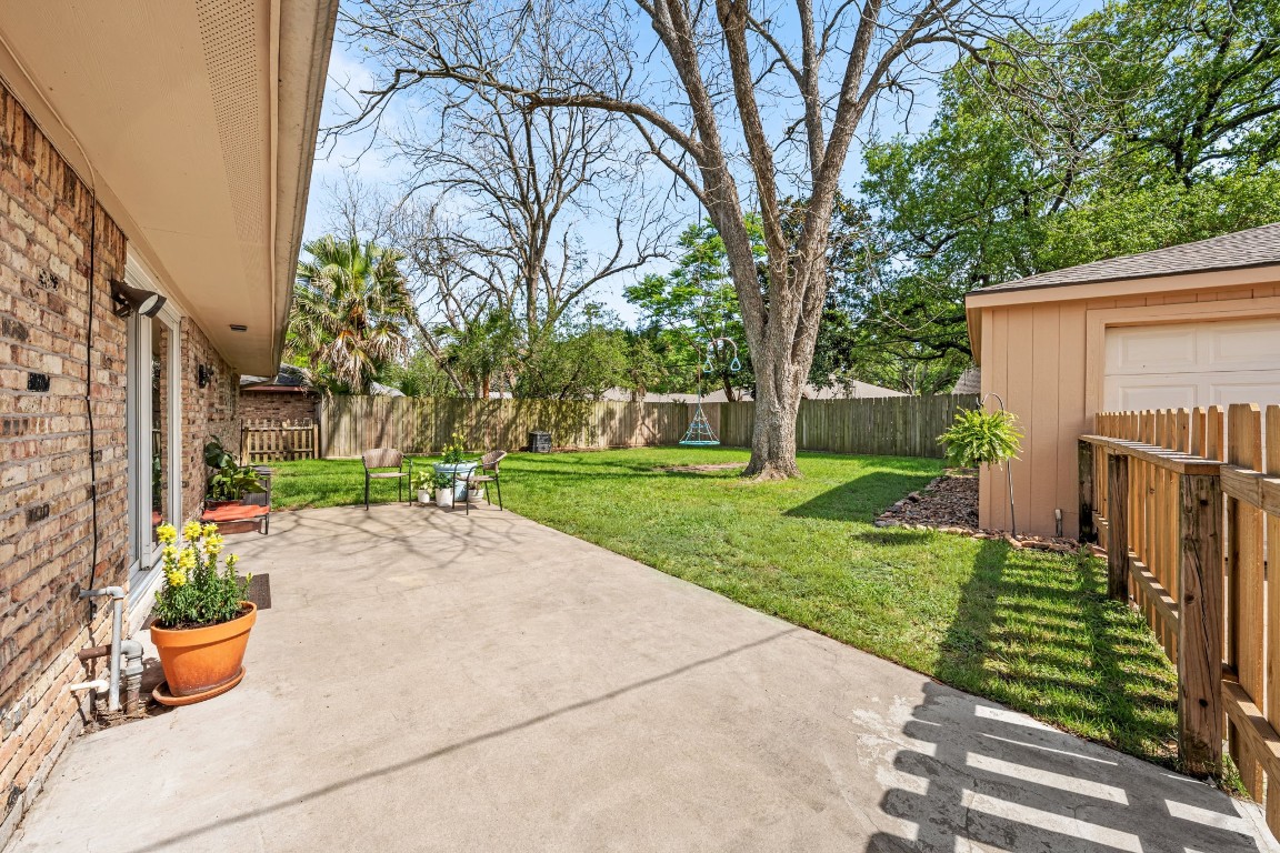 5827 Rutherglenn Drive Houston, TX 77096 - Photo 24 of 30 a view of a garden with potted plants and large trees