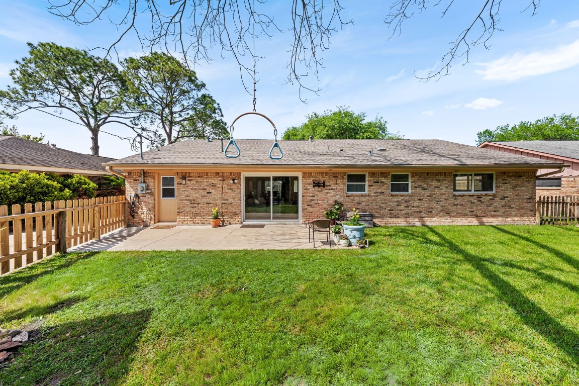 5827 Rutherglenn Drive Houston, TX 77096 - Photo 25 of 30 a view of a house with a yard porch and sitting area
