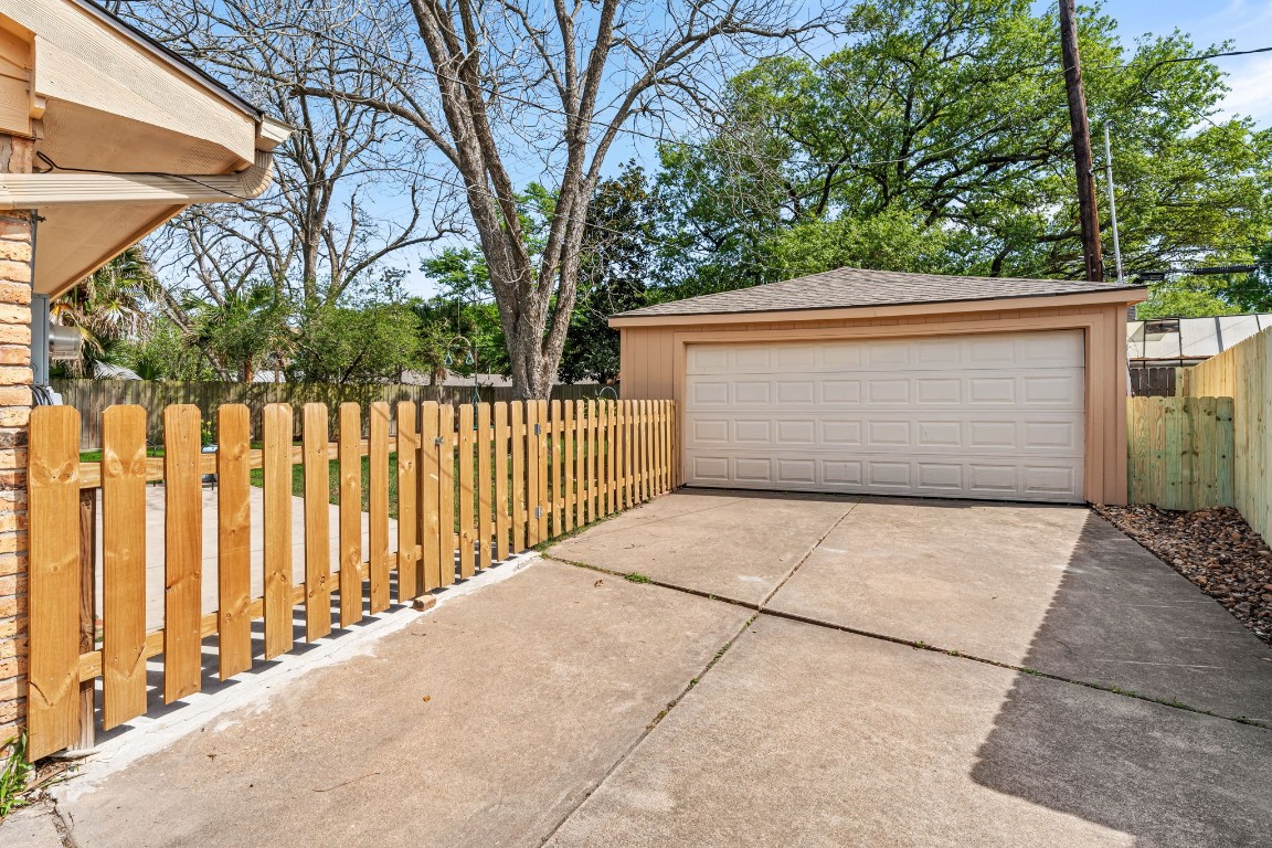 5827 Rutherglenn Drive Houston, TX 77096 - Photo 27 of 30 a front view of a house with a garage