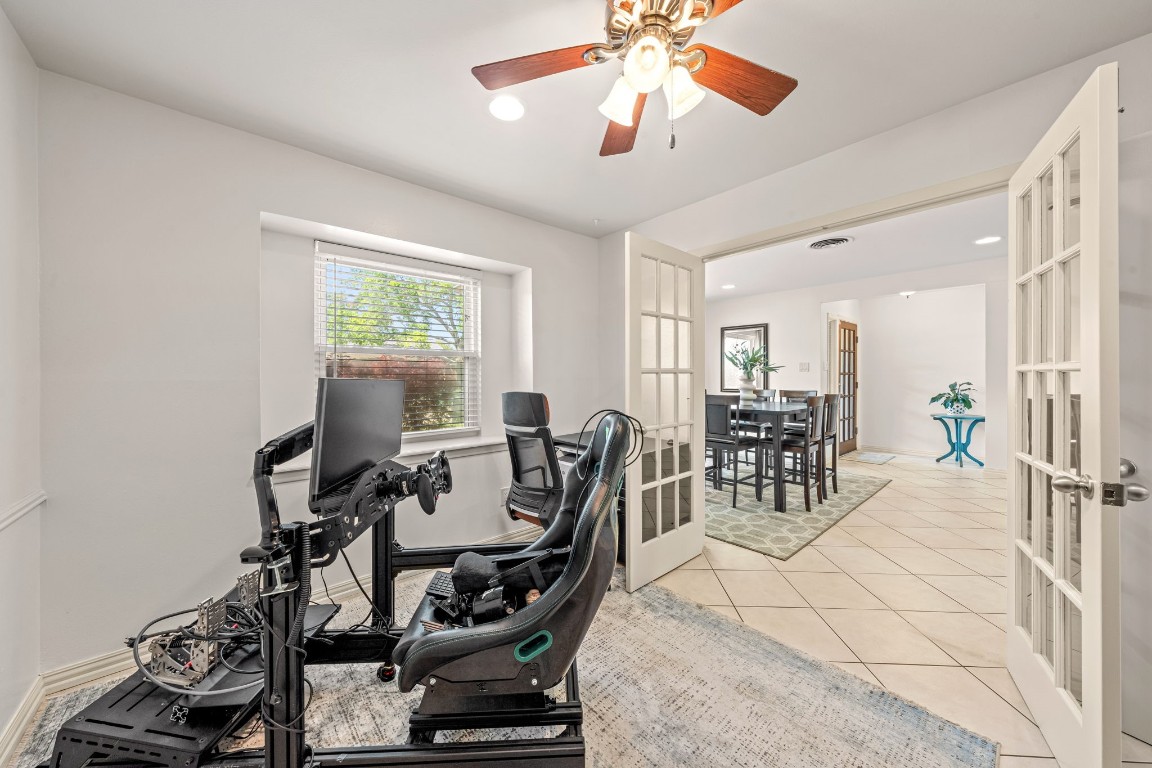5827 Rutherglenn Drive Houston, TX 77096 - Photo 6 of 30 a view of a dining room with furniture and a chandelier