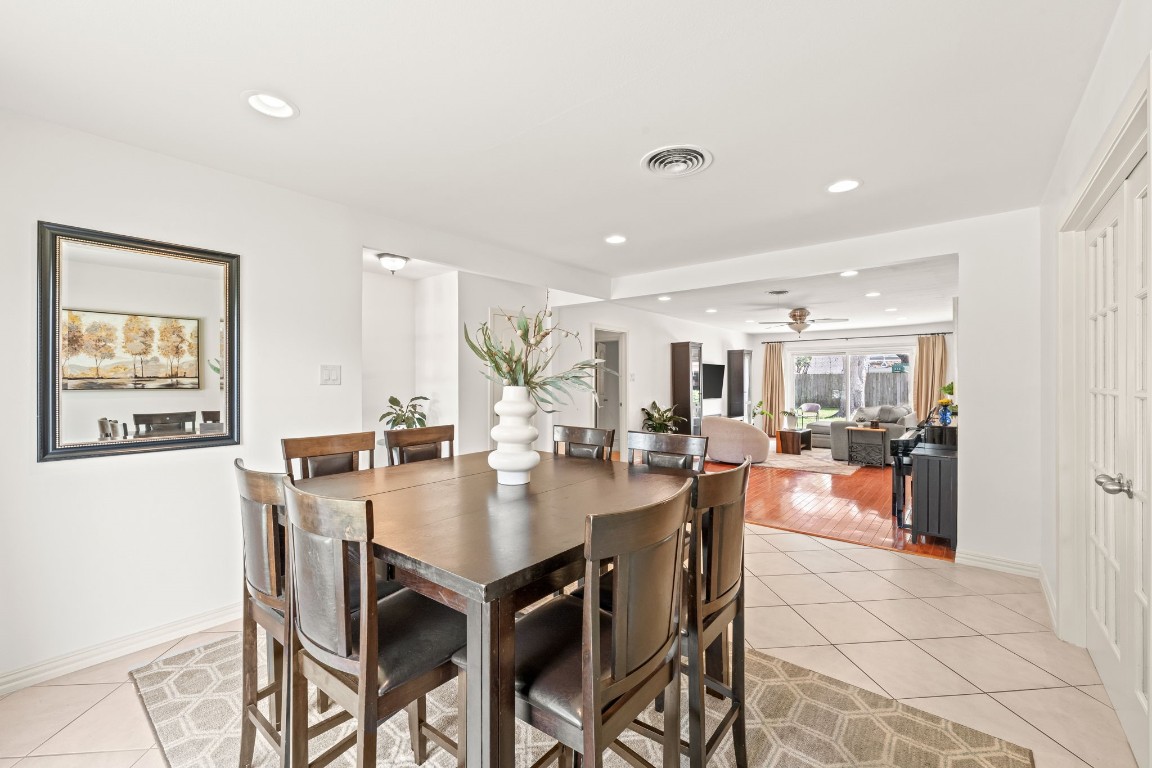 5827 Rutherglenn Drive Houston, TX 77096 - Photo 7 of 30 a dining room with furniture and a floor to ceiling window