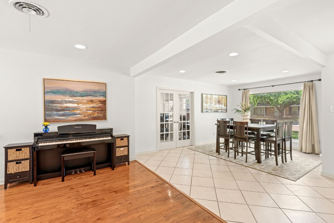 5827 Rutherglenn Drive Houston, TX 77096 - Photo 29 of 30 a living room with furniture a piano and a flat screen tv