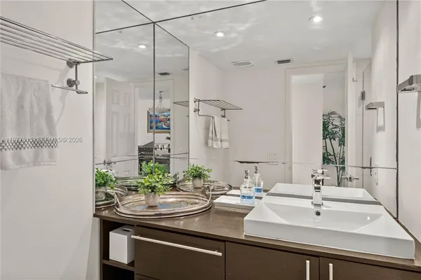 a bathroom with a sink and a mirror