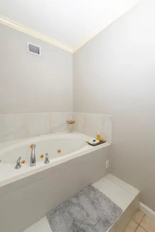 a bathroom with a bathtub and a sink