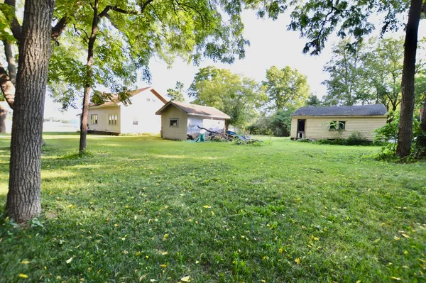 a house with a tree in front of a house