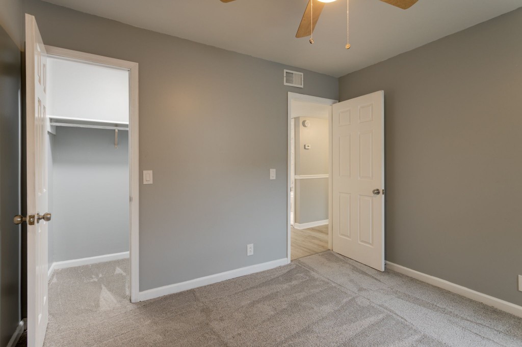 245 Warrior Road Madison, TN 37115 - Photo 15 of 24 an empty room with closet and a chandelier fan