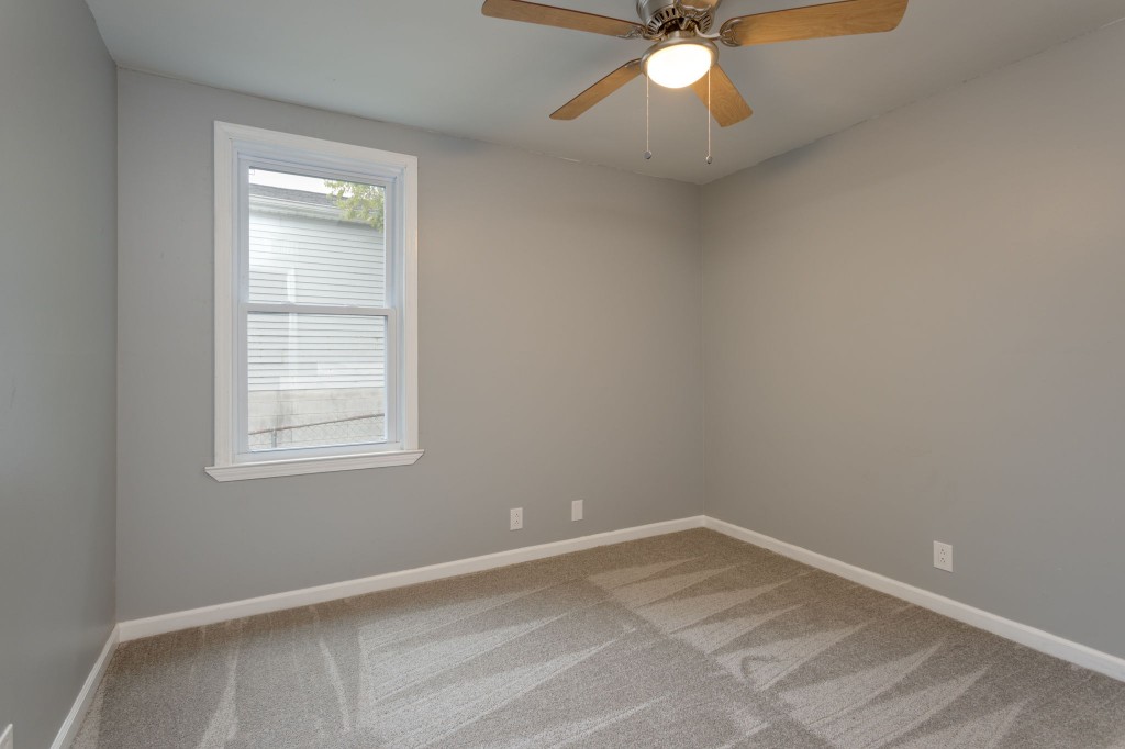 245 Warrior Road Madison, TN 37115 - Photo 16 of 24 an empty room with a window and a fan