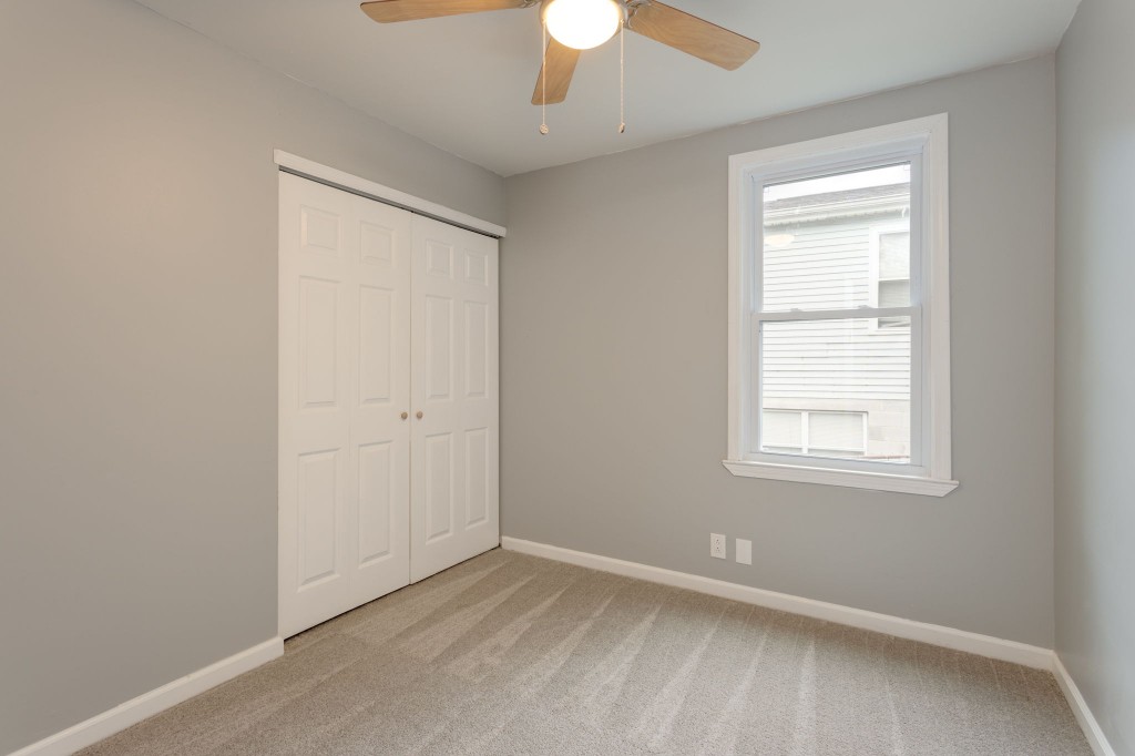 245 Warrior Road Madison, TN 37115 - Photo 17 of 24 an empty room with a window and a ceiling fan