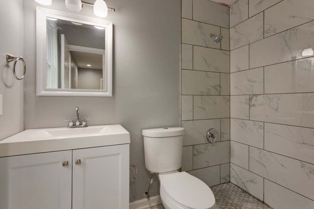 245 Warrior Road Madison, TN 37115 - Photo 18 of 24 a bathroom with a toilet sink and mirror