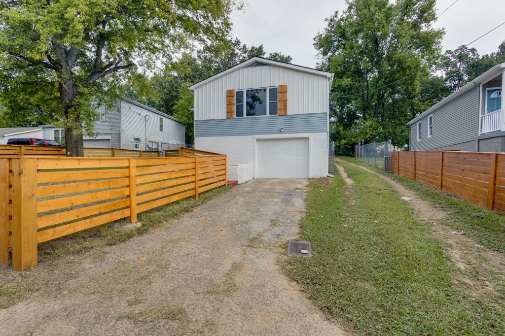 245 Warrior Road Madison, TN 37115 - Photo 3 of 24 a front view of a house with a yard