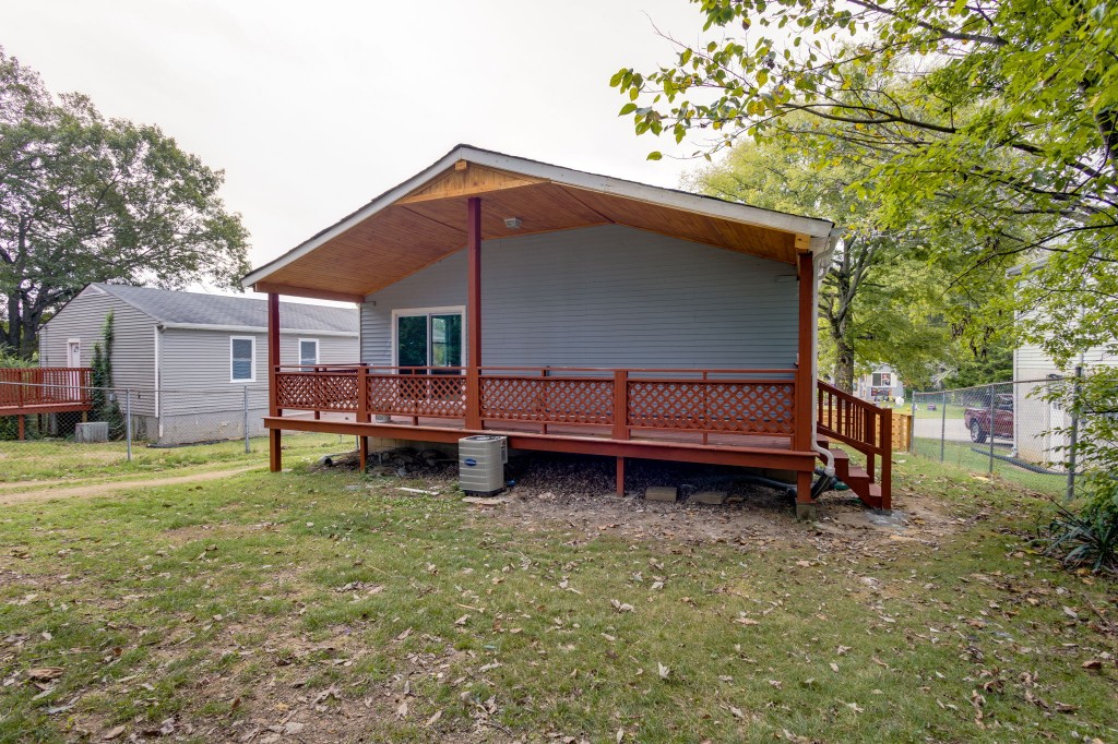 245 Warrior Road Madison, TN 37115 - Photo 21 of 24 a backyard of a house with barbeque oven and trees