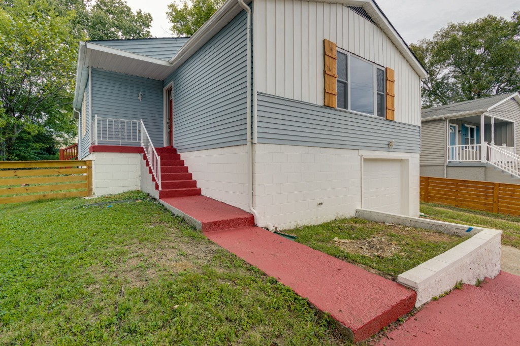 245 Warrior Road Madison, TN 37115 - Photo 5 of 24 a front view of a house with a yard