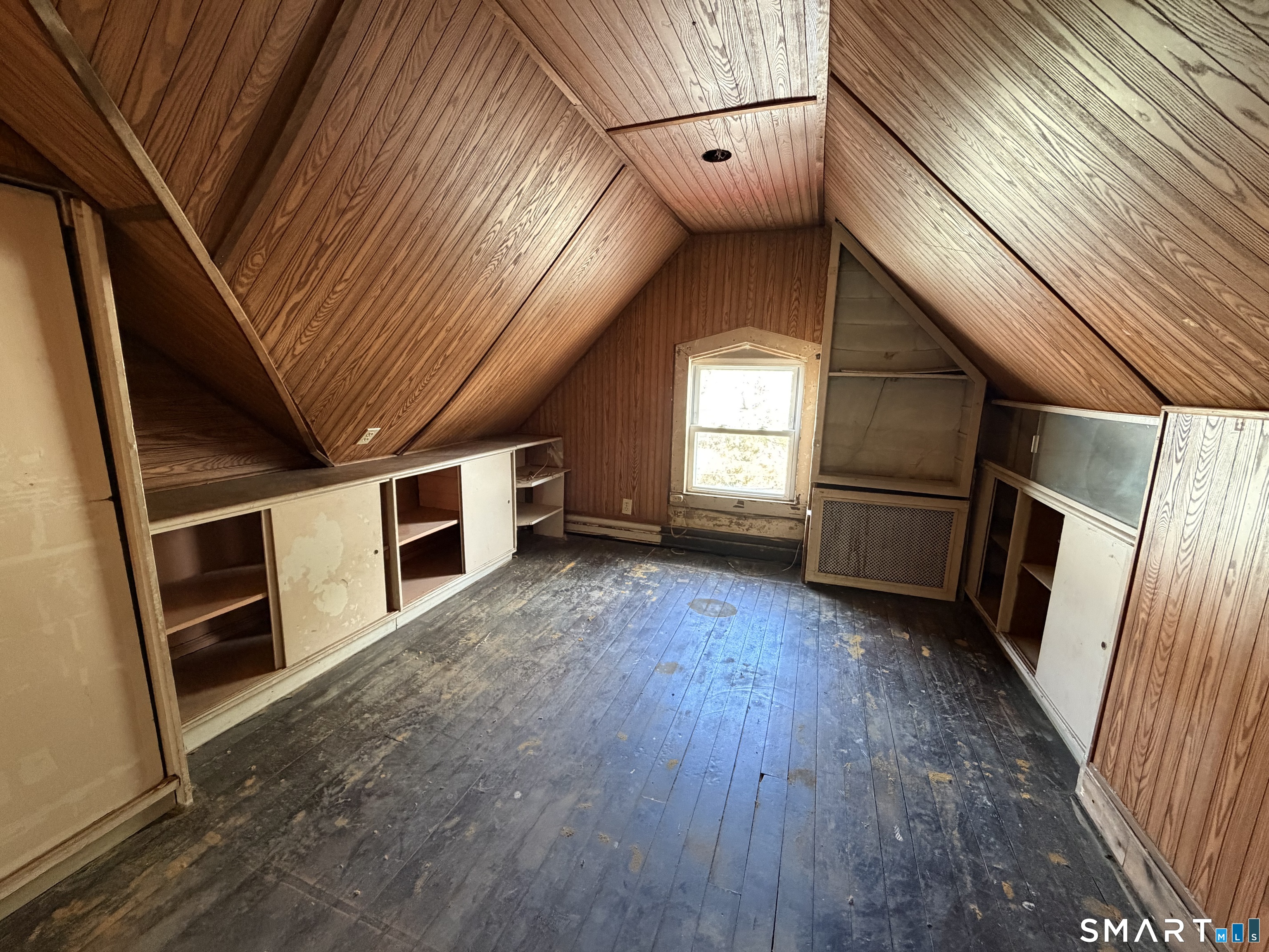 111 Waterman Street Bridgeport, CT 06607 - Photo 14 of 14 a view of an empty room with wooden floor and windows