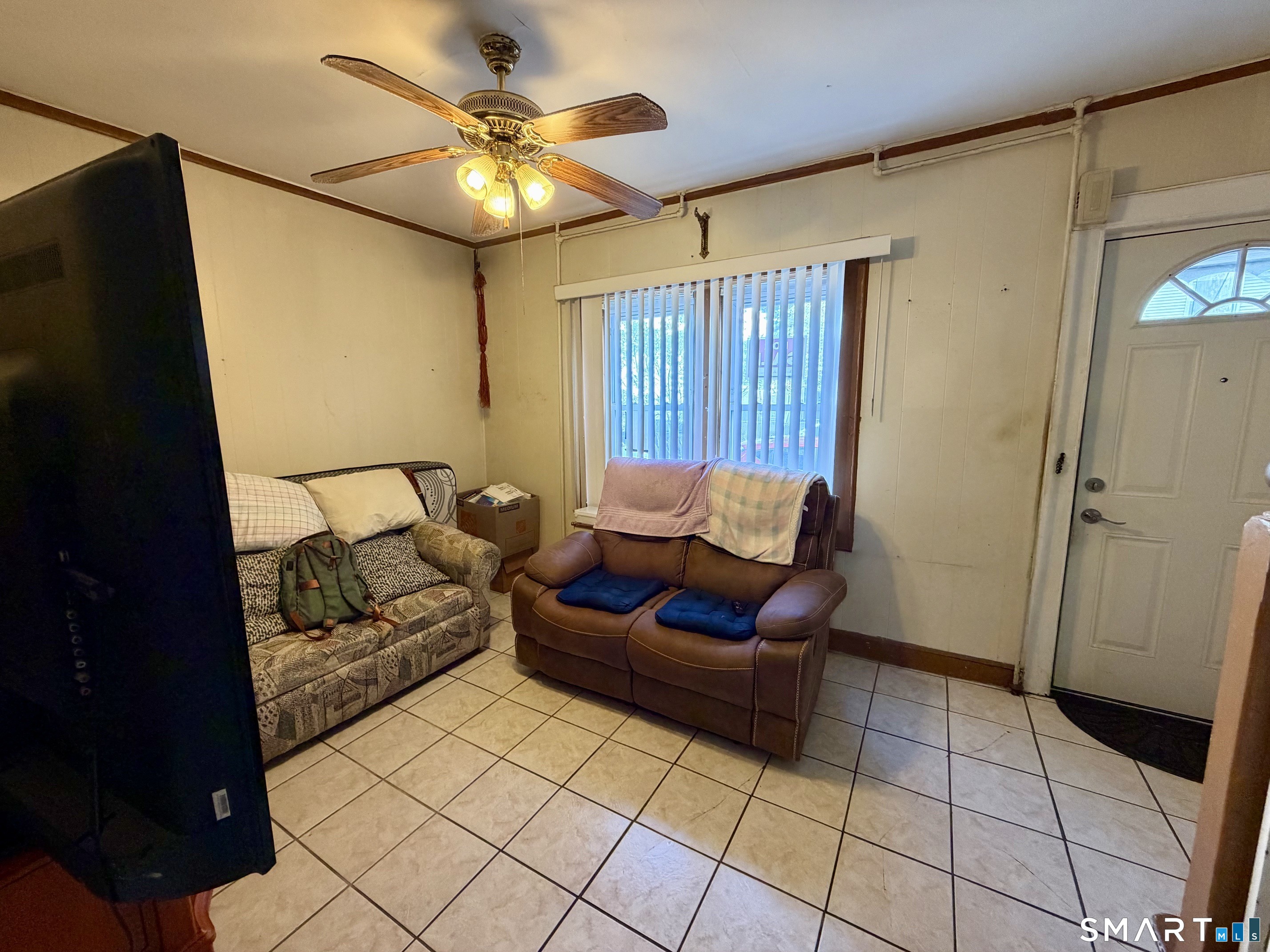 111 Waterman Street Bridgeport, CT 06607 - Photo 3 of 14 a living room with furniture and a rug