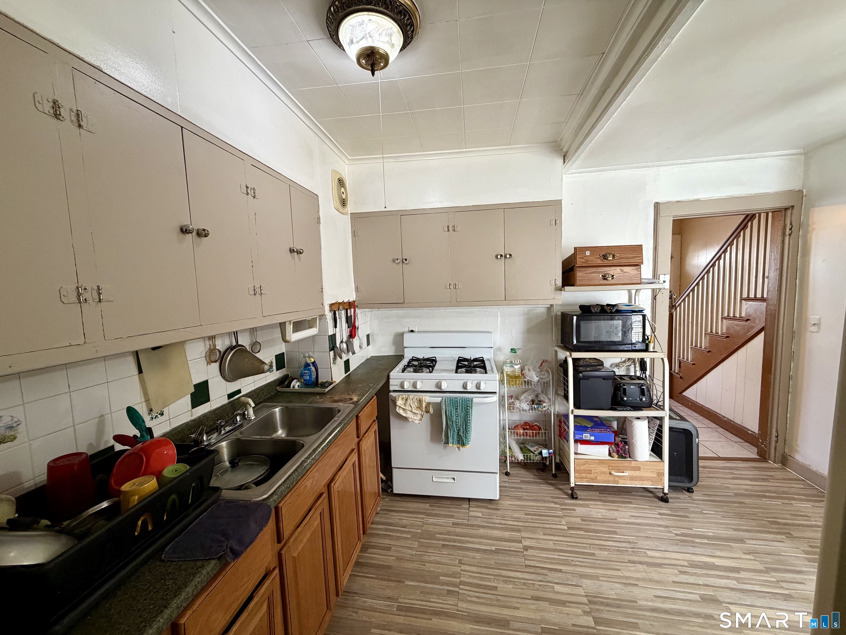 111 Waterman Street Bridgeport, CT 06607 - Photo 6 of 14 a kitchen that has a lot of cabinets in it