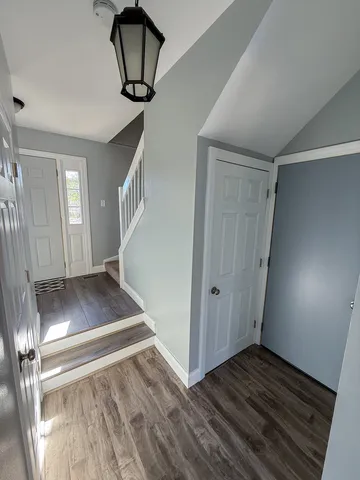 a view of entryway with wooden floor