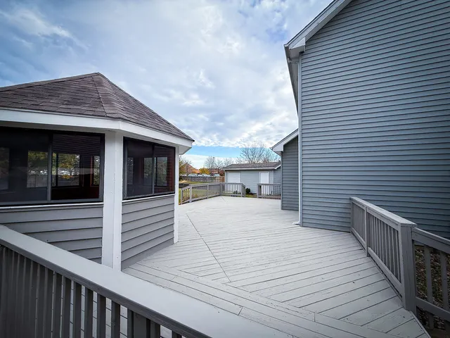 a view of a terrace with wooden floor and seating space