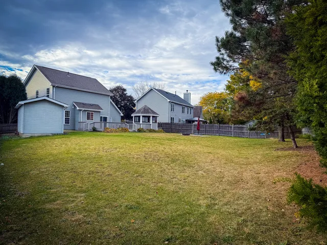 a house view with swimming pool in front of it