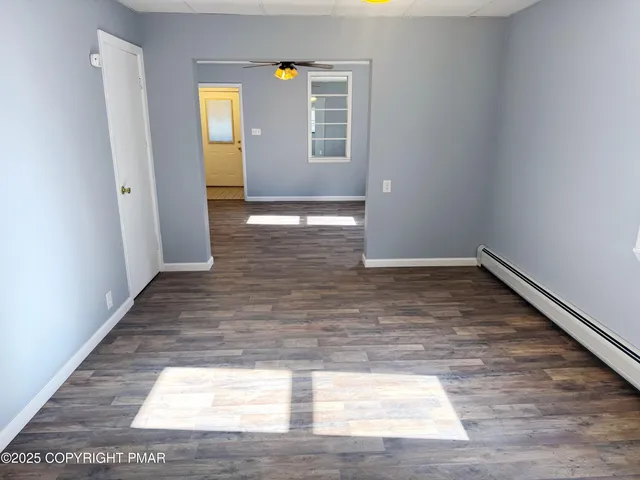 a view of an empty room and window