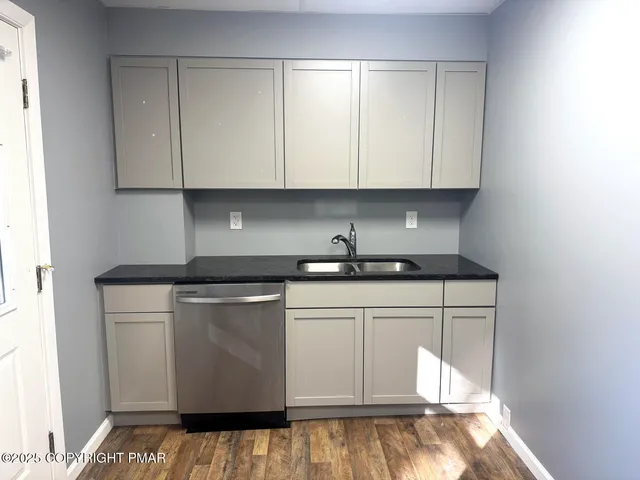 a kitchen with white cabinets