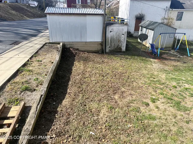 a view of a backyard of the house
