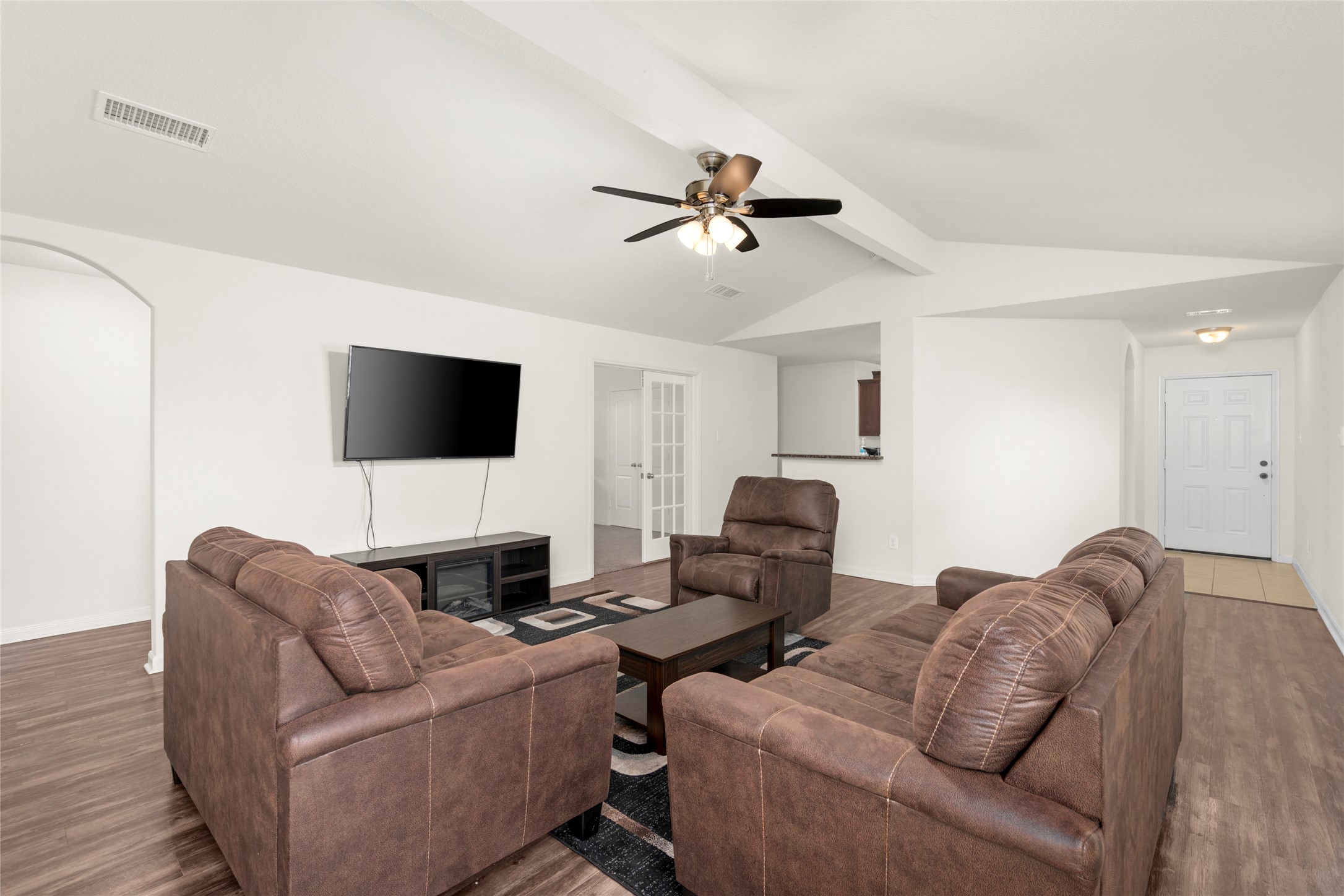 9719 Montana Sapphire Lane Rosharon, TX 77583 - Photo 5 of 40 Open-concept living area featuring high ceilings, natural light, and a spacious layout designed for everyday living.