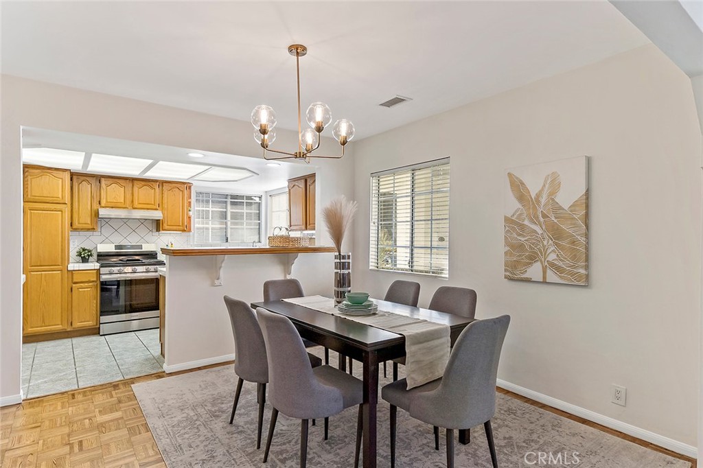 12216 Old River School Road Downey, CA 90242 - Photo 12 of 36 a view of a dining room with furniture window and wooden floor