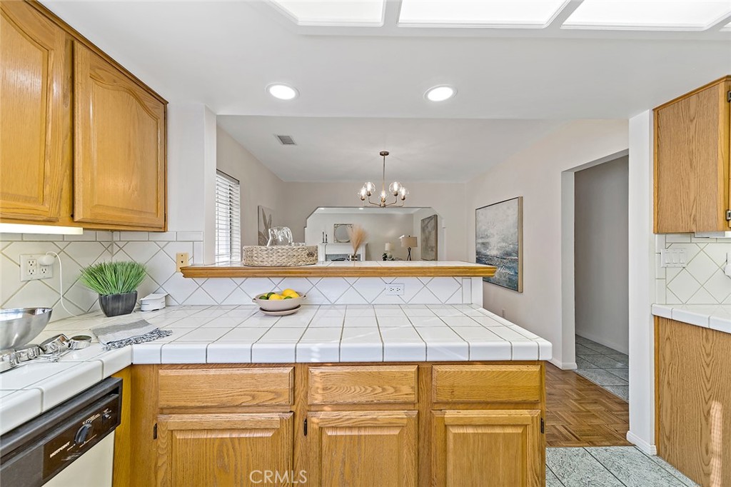 12216 Old River School Road Downey, CA 90242 - Photo 15 of 36 a kitchen with counter top space cabinets and appliances