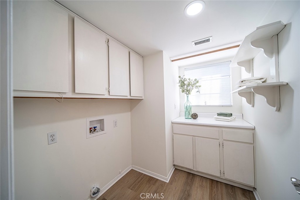 12216 Old River School Road Downey, CA 90242 - Photo 16 of 36 a room with a sink and cabinets