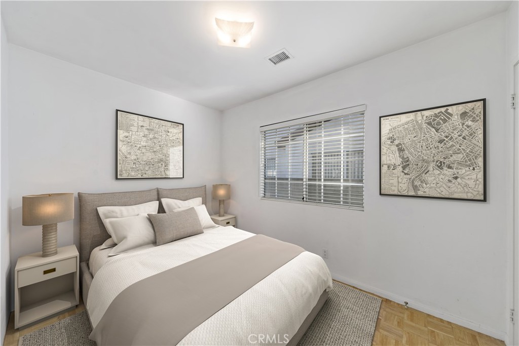 12216 Old River School Road Downey, CA 90242 - Photo 17 of 36 a bedroom with a bed and a window