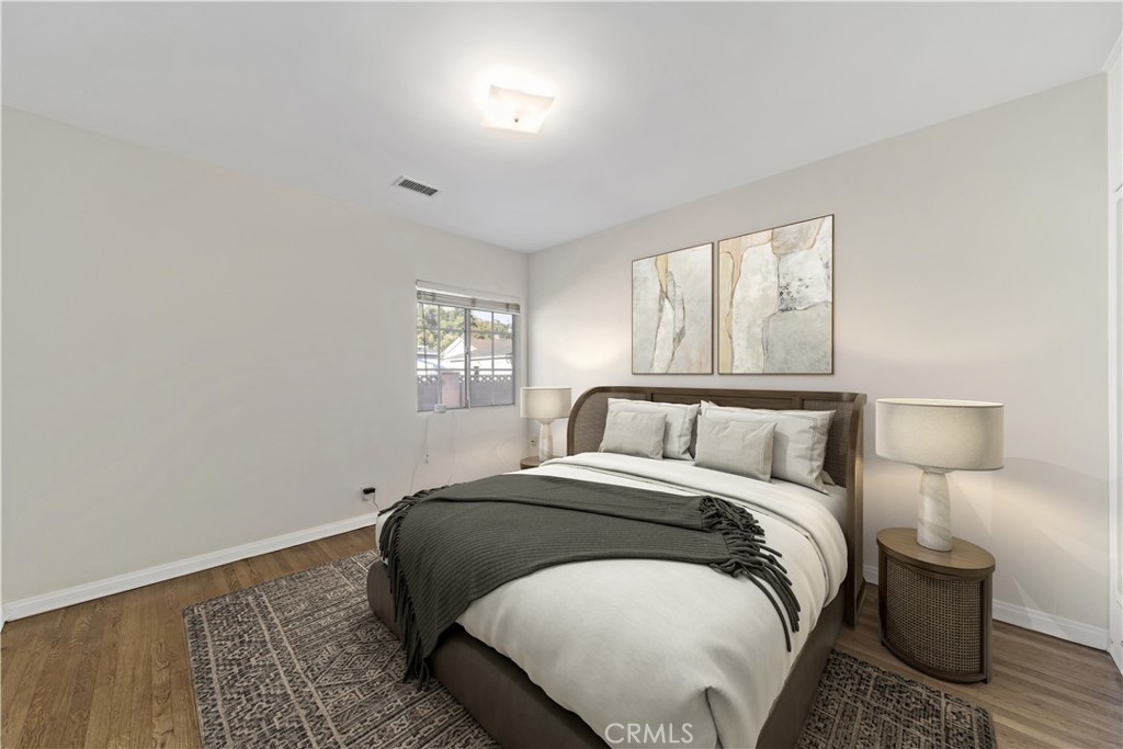 12216 Old River School Road Downey, CA 90242 - Photo 19 of 36 a bed sitting in a bedroom next to a window