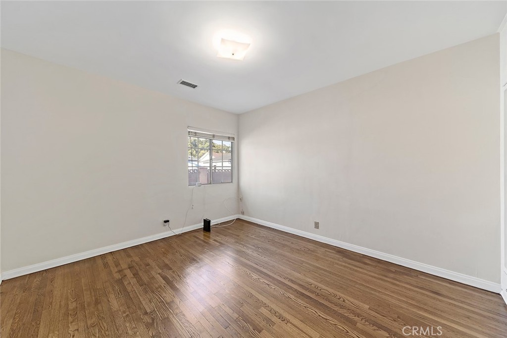 12216 Old River School Road Downey, CA 90242 - Photo 20 of 36 an empty room with wooden floor and windows