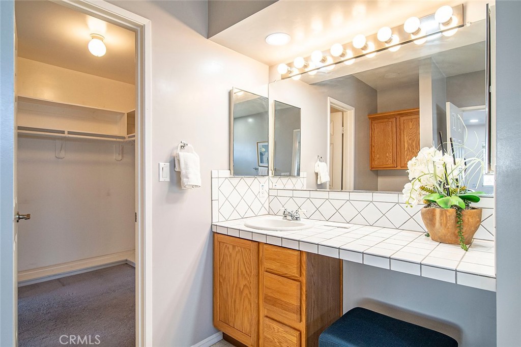 12216 Old River School Road Downey, CA 90242 - Photo 25 of 36 a bathroom with a sink and a mirror