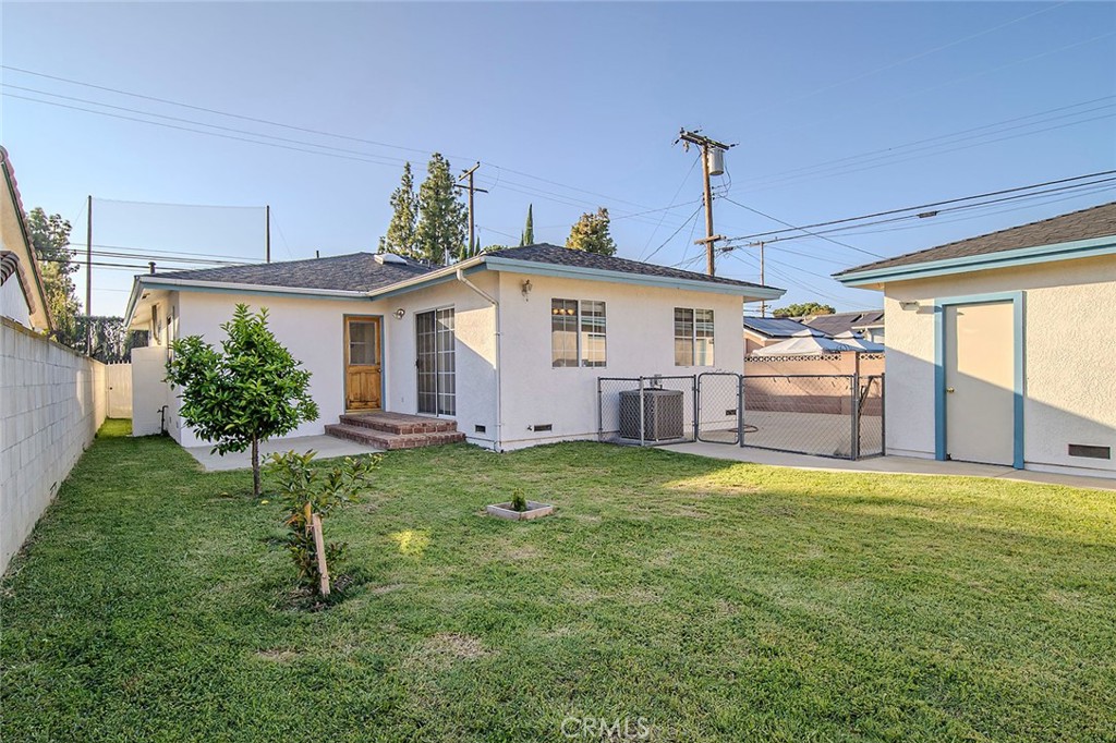 12216 Old River School Road Downey, CA 90242 - Photo 27 of 36 a view of a house with backyard and a garden