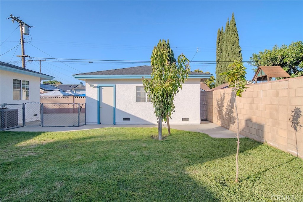 12216 Old River School Road Downey, CA 90242 - Photo 28 of 36 a view of a backyard with a house and a yard