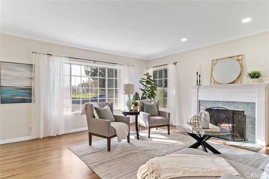 12216 Old River School Road Downey, CA 90242 - Photo 6 of 36 a living room with furniture and a fireplace
