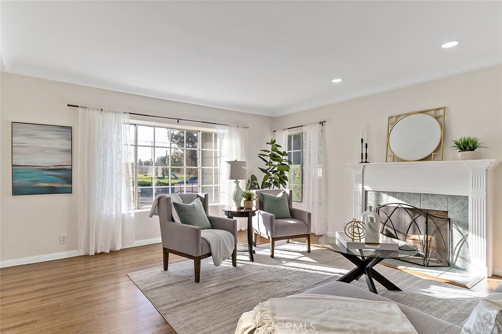 12216 Old River School Road Downey, CA 90242 - Photo 9 of 36 a living room with furniture and a fireplace
